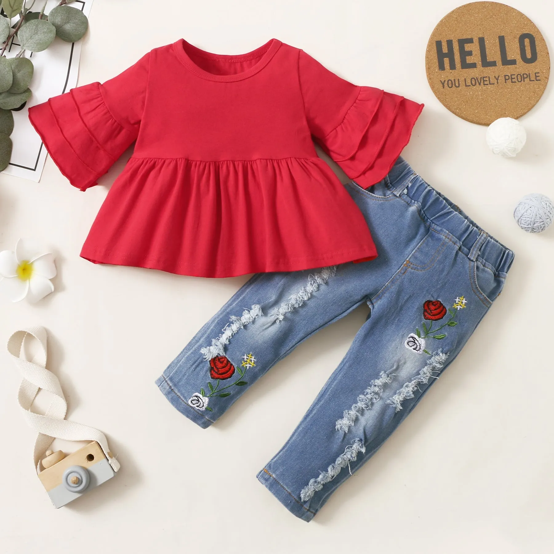 2pcs Baby Red Bell Sleeve Loose-fit Top and Floral Embroidered Ripped Denim Jeans Set