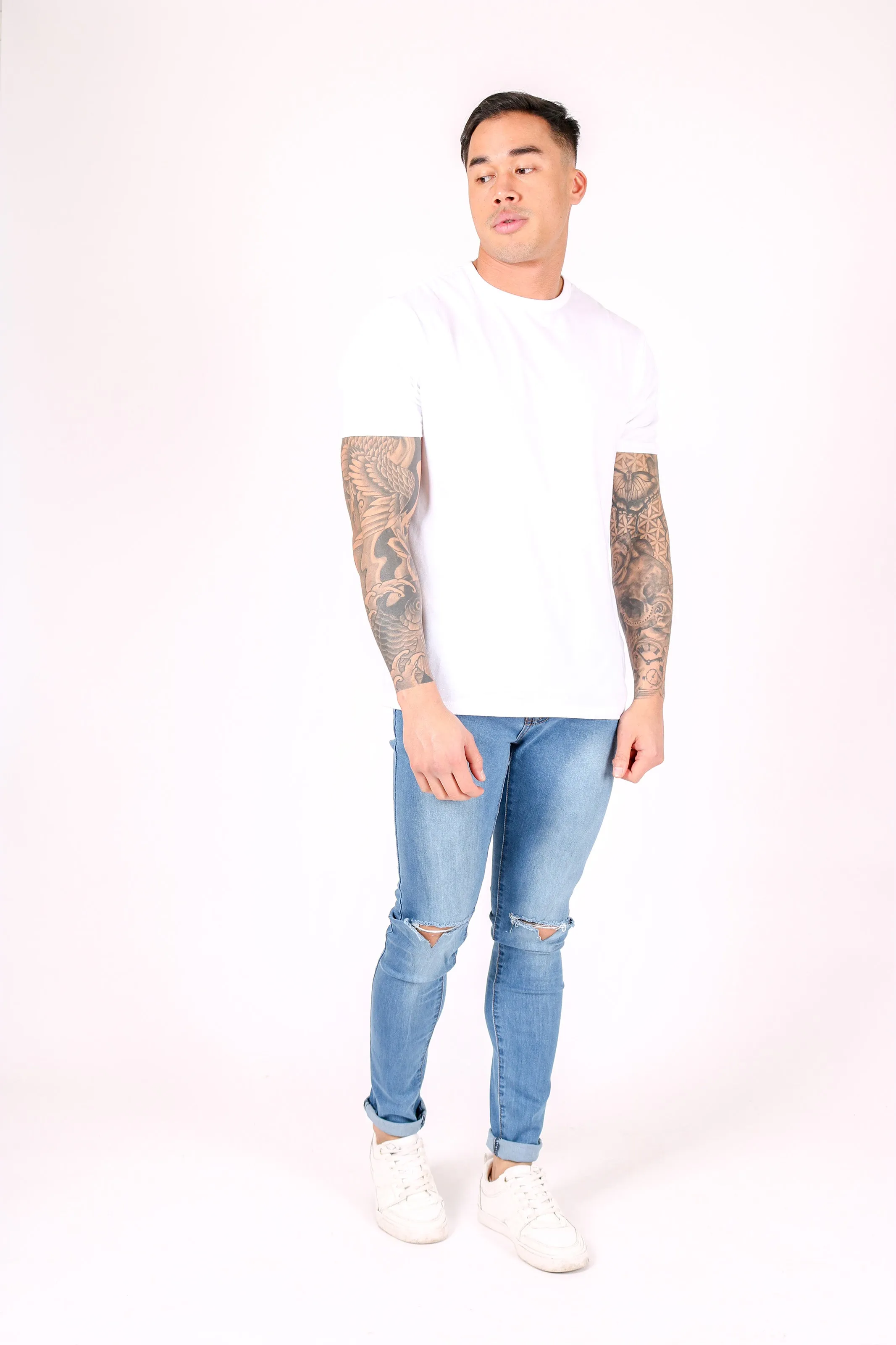 Logan Skinny Stretch Jeans In Light Stonewash With Ripped Knee